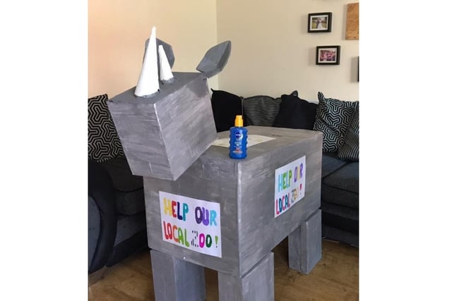 A cardboard rhino pleading for support for Marwell