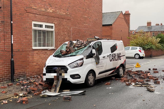 A van suffers damage as a result of the storm.