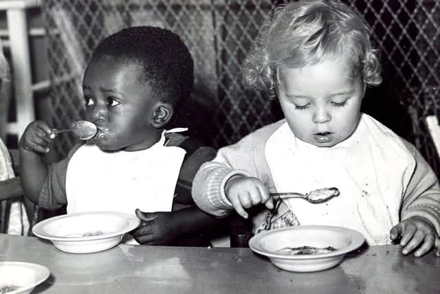 With his little friend, Tony Copwell is getting stuck in to a good old nursery tea, in October 1959