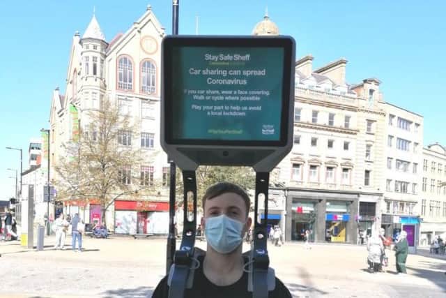 One of the iWalkers displaying a Covid-19 awareness message in Sheffield city centre