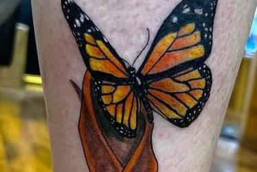 Amanda Davidson said: "My husband was diagnosed with MS 15 years ago. I had this butterfly and MS ribbon tattoo last week on my calf."