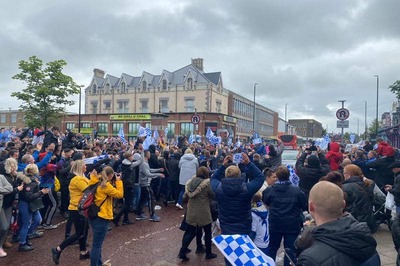 Fans lined the streets of Hartlepool to clap and cheer players following their promotion.