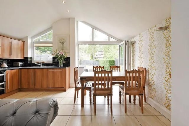 The spacious, extended open plan dining kitchen benefits from under floor heating.