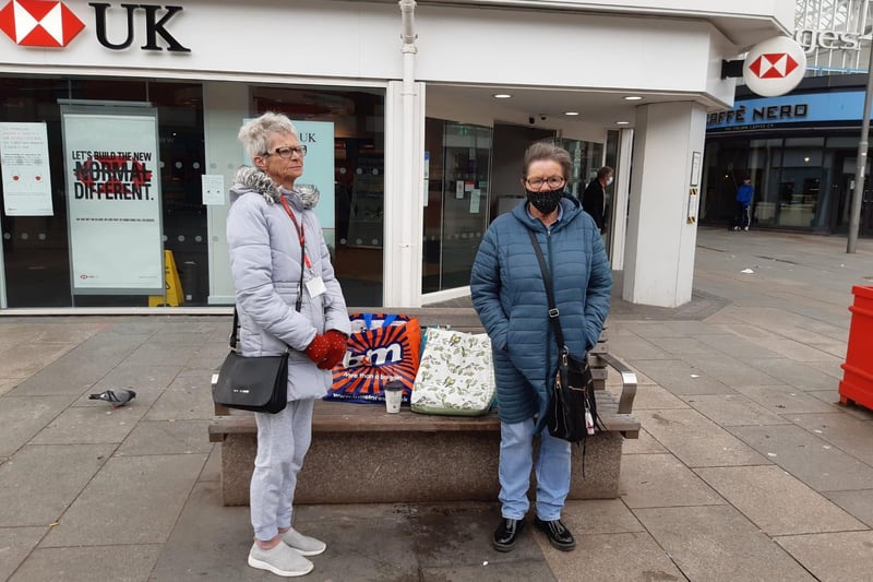 These visitors were among those to stop and join in the minute's silence, which was held across the UK to mark the anniversary of the start of the lockdowns.