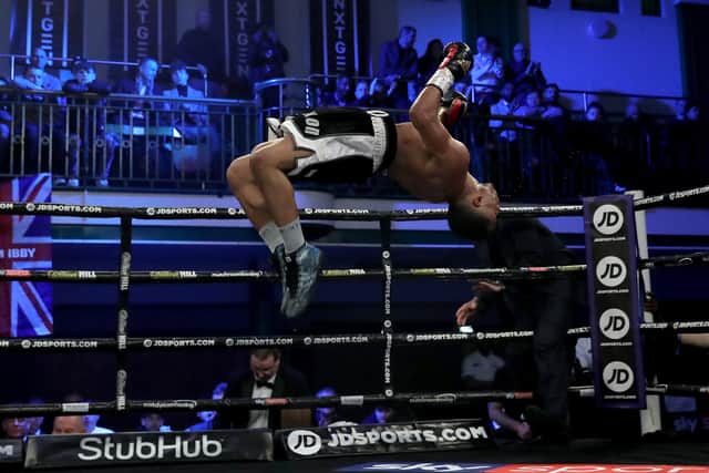 Donte Dixon executes his trademark backflip after beating Vladislavs Davidaits in 2019 (photo by James Chance/Getty Images).