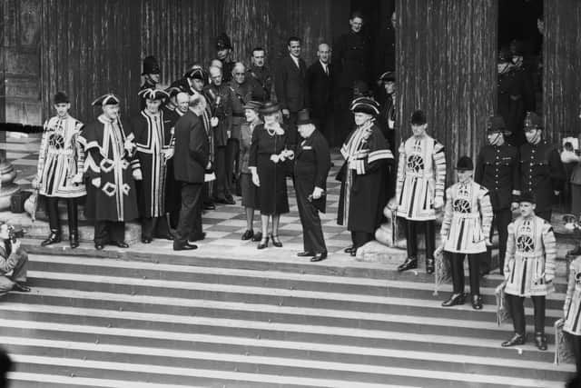 Prime Minister Winston Churchill, with his wife Clementine and daughter Mary, arrives at St Paul's Cathedral for a thanksgiving service after VE Day.