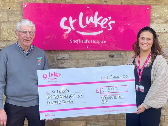 Laura Martin receives a cheque from Sickleholme captain Phil Sharman