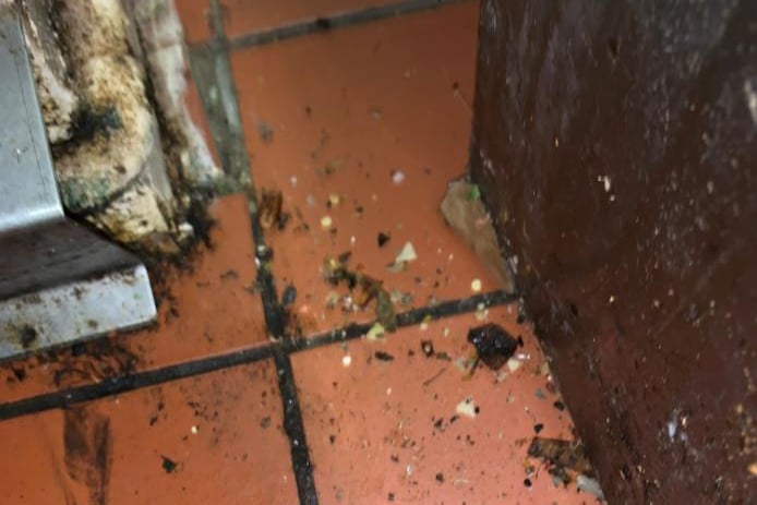 The council has said this image shows the dirt and rat faeces which was found on the floor of the takeaway.