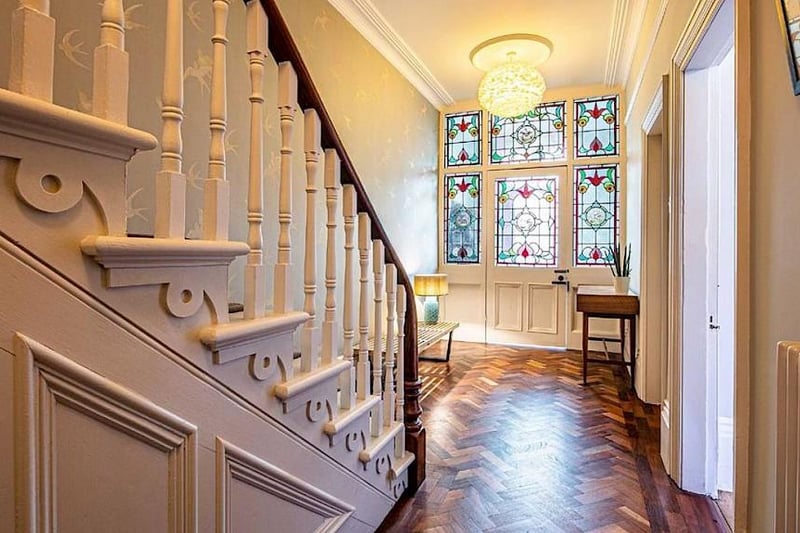 On the ground floor there is a beautiful stained-glass vestibule which leads into a hallway with reclaimed teak parquet flooring.