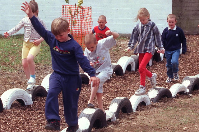 Children using the new play area, created by Prince's Trust volunteers, at Park Hill Primary school, on Duke Street, Sheffield, in 1998