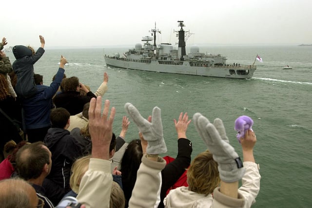 14th April 2004. Friends and relatives bid farewell to HMS Cardiff from the Round tower as she sets sail for the Falklands.
Picture: Jonathan Brady (041968-43)
