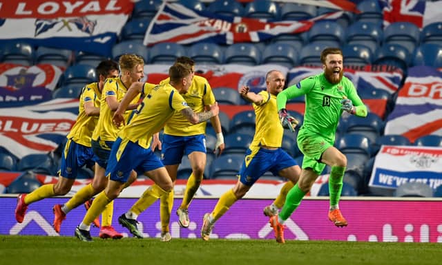 Goalkeeper Zander Clark is chased by his St Johnstone team mates after assisting Chris Kane's last gasp extra-time equaliser against Rangers at Ibrox. (Photo by Rob Casey / SNS Group)