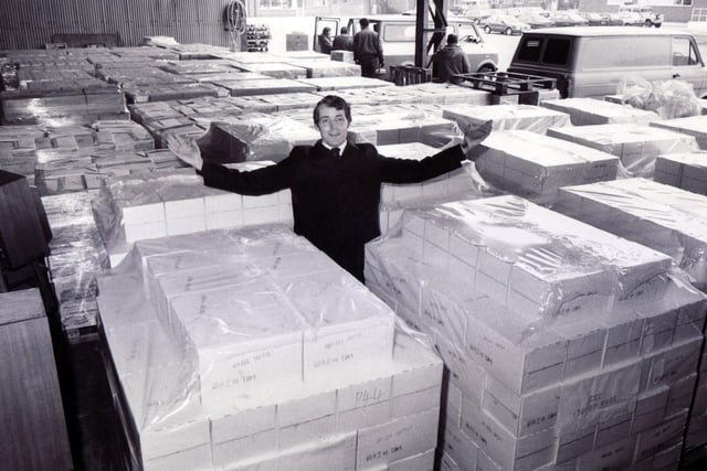 Captain Melvin Hart of the Salvation Army pictured amid the tons of milk and cheese from the EEC ready for disposal to elderly people in Sheffield, March 1987