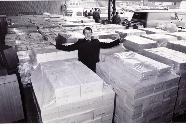 Captain Melvin Hart of the Salvation Army amid the tons of milk and cheese from the EEC ready for disposal to elderly people in Sheffield in March 1987