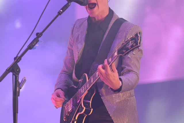 Alex Turner of the Arctic Monkeys performing on the Pyramid Stage at Glastonbury 2013