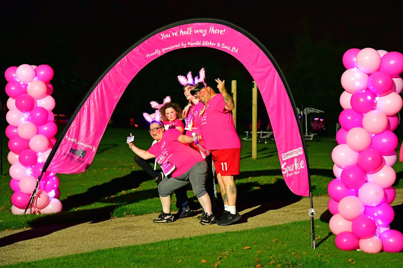 These walkers strike a pose as they reach the halfway stage of the Sparkle Walk.