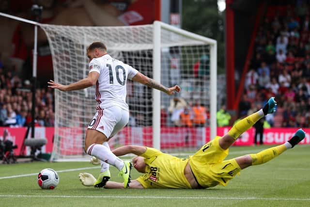 Billy Sharp (L) of Sheffield United takes the ball around Aaron Ramsdale of Bournemouth during the Premier League match at the Vitality Stadium, Bournemouth: James Wilson/Sportimage