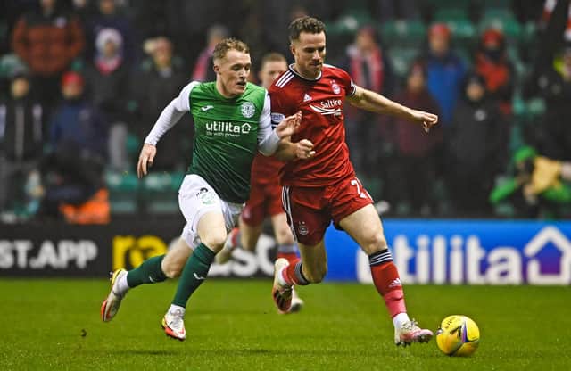 Jake Doyle-Hayes battles Aberdeen's Marley Watkins during the first half of the match at Easter Road. Picture: SNS