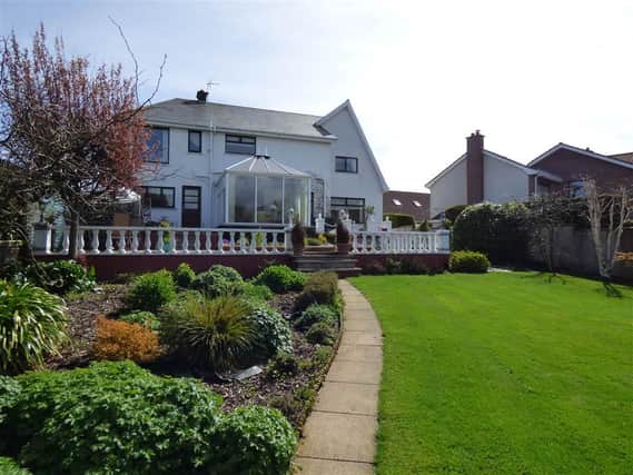The impressive detached home has spacious gardens to both the front and rear.  Photo: Brian A Todd estate agents