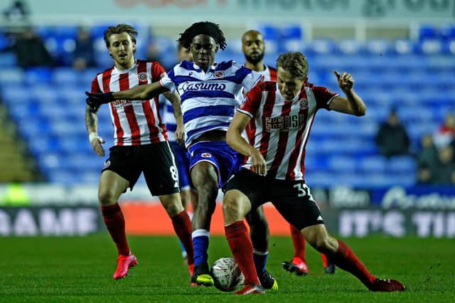 Reading's Ovie Ejana (C) vies with Sheffield United's Sander Berge during the FA cup fifth round football match at the Madejski stadium in Reading on March 3, 2020  (ADRIAN DENNIS/AFP via Getty Images)