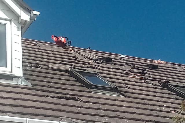 A chainsaw could be seen lodged in the roof of the property on Bradley Street in Crookes, Sheffield