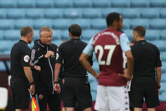 Chris Wilder, Manager of Sheffield United interacts with match officials at full-time after the Premier League match between Aston Villa and Sheffield United at Villa Park on June 17, 2020 in Birmingham, England. (Photo by Carl Recine/Pool via Getty Images)