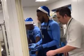 Chey Dunkley's team lost and had to serve the rest of the Sheffield Wednesday team's dinner. (via @bazzaboi10 on Instagram)
