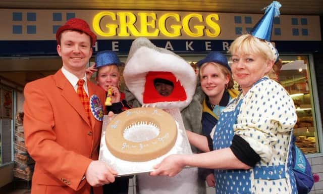 The Waterdale Greggs opened in 1999, here staff are celebrating with Paul Hudson, BBC weatherman who is holding a giant donut.