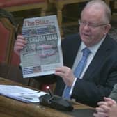 Neale Gibson, representing Andrew Cuneo, right, holding up a copy of The Star at a meeting of Sheffield City Council's planning committee