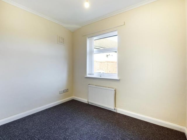 Bedroom 2 - uPVC double glazed window to the front elevation, ceiling coving, fitted linen closet housing the wall mounted gas boiler, radiator panel and power point.