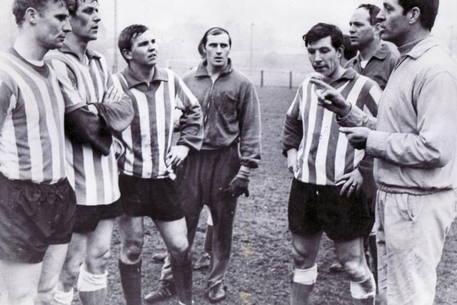 Lawrie McMenemy, right, is pictured chatting to Wednesday players and staff at their Thorncliffe Training Ground in 1968. The future Southampton and Sunderland manager  was a coach at Wednesday for two years before leaving to manage Doncaster Rovers.