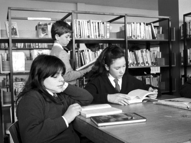 Children reading quietly in the school library at St Augustine's RC secondary school in Edinburgh, January 1990.