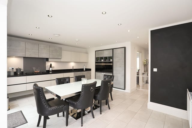 The beautiful home offers an open plan and contemporary styled kitchen and dining area