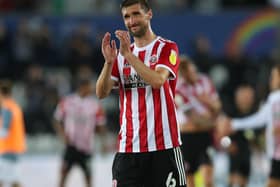 Chris Basham of Sheffield United applauds the travelling fans after United's draw at Swansea: Simon Bellis / Sportimage