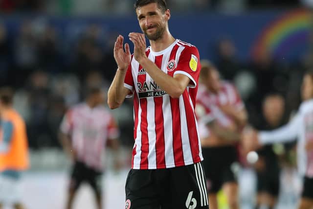 Chris Basham of Sheffield United applauds the travelling fans after United's draw at Swansea: Simon Bellis / Sportimage