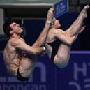 Sheffield diving pair Rass Haslam (L) and Yasmin Harper compete in the final of the Mixed Team Diving event.