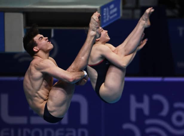 Sheffield diving pair Rass Haslam (L) and Yasmin Harper compete in the final of the Mixed Team Diving event.