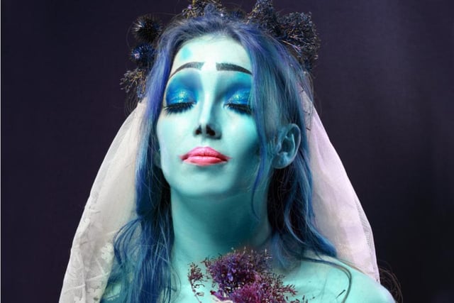 Create the zombie bride look with pale white or blue face paint (or foundation and eye shadow), and add dustings of black around the eyes for that deathly feel, complete with frosty blue or pink lipstick.