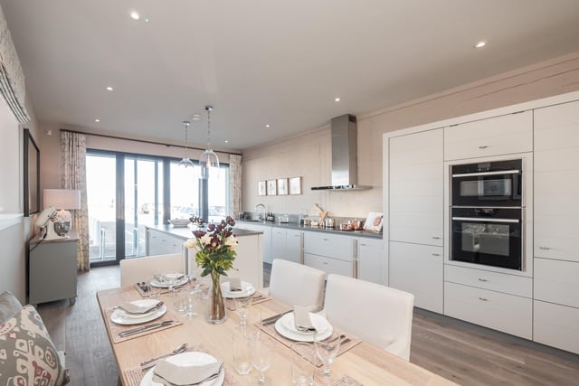 The large dining area in a penthouse at the Moorings waterside development offers unparalleled views. Contact DJ Alexander for more information or to arrange a show home tour.