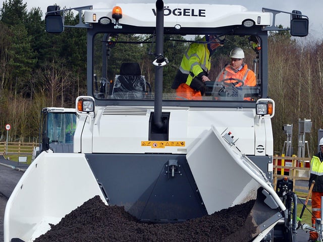 The Duke of Cambridge visits Tarmac's national skills and safety park to officially open the centre. The Duke of Cambridge laying down some tarmac.