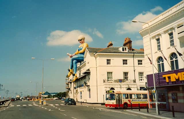 A giant balloon in the shape of a woman, sits on the roof above Bar Bluu in South Parade in 1999. Picture: Courtesy of Doreen Gallacher. If anyone can remember the reason for her being there please let us know.