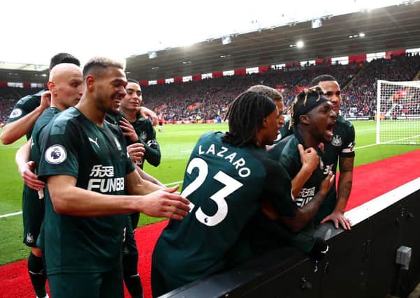 SOUTHAMPTON, ENGLAND - MARCH 07: Allan Saint-Maximin of Newcastle United celebrates with teammates after scoring his team's first goal during the Premier League match between Southampton FC and Newcastle United at St Mary's Stadium on March 07, 2020 in Southampton, United Kingdom. (Photo by Jordan Mansfield/Getty Images)