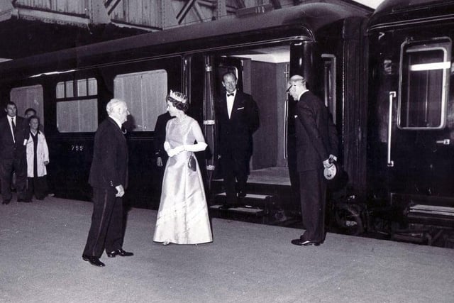 The Royal train draws into Midland Station - July 29, 1975. The Queen with Prince Philip behind her, are greeted by the Lord Mayor of Sheffield (Coun Albert Richardson) with the Station Manager, Mr. Ralph Tunnicliffe on the right