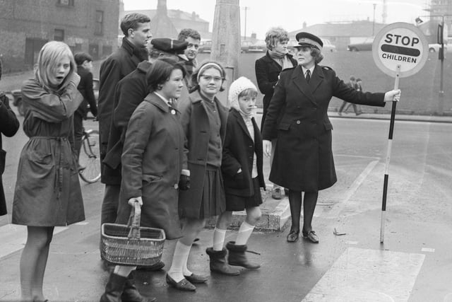 Ena Thompson conducts pedestrians over a crossing on her High Street to Chester Road "beat".  She was pictured in 1968.
