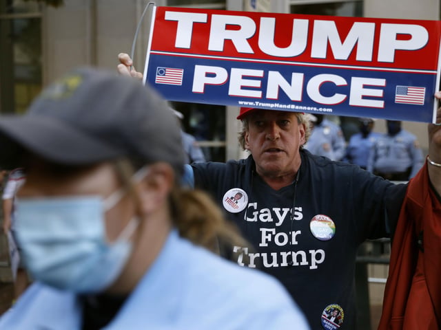 A supporter of President Donald Trump demonstrates outside the Pennsylvania Convention Center (AP Photo/Rebecca Blackwell)