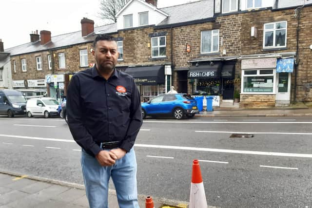 Banner Cross sub-postmaster Nasar Raoof next to a hole dug for a street tree opposite his business on Ecclesall Road, Sheffield. Picture: Julia Armstrong, LDRS