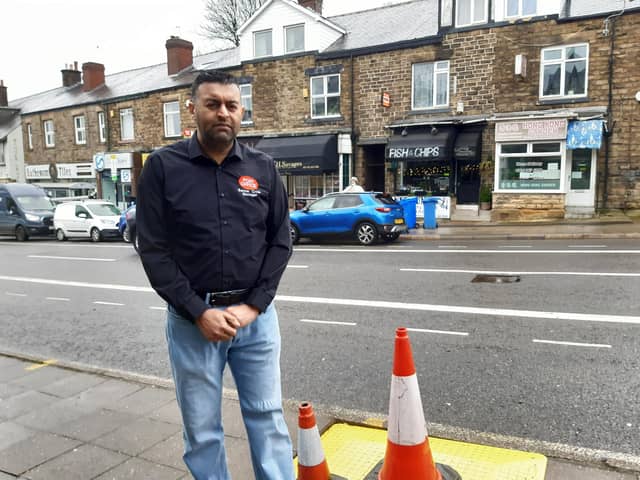 Banner Cross sub-postmaster Nasar Raoof next to a hole dug for a street tree opposite his business on Ecclesall Road, Sheffield. Picture: Julia Armstrong, LDRS