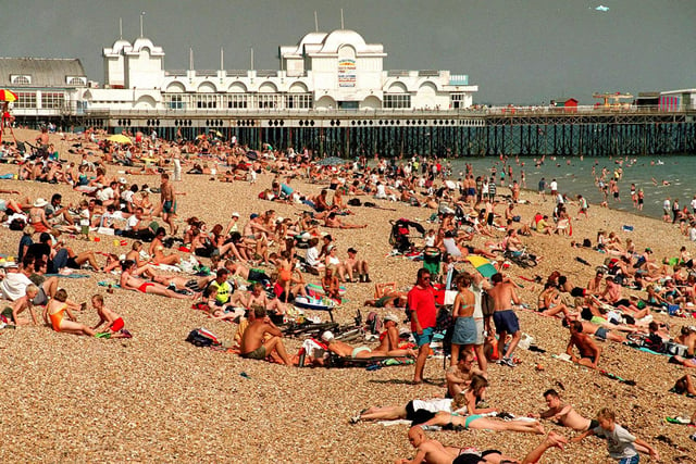 The News reader, Ann Palmer, suggested to go and paddle in the sea once you get here. This was a packed Southsea beach in 1999.