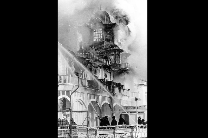 Southsea firefighters put out the flaming pier on June 11, 1974. The News PP4153