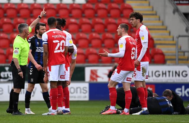 Referee Darren Bond instructs Matt Crooks of Rotherham United (R) to leave the field after being sent off during the Sky Bet Championship match between Rotherham United and Middlesbrough at AESSEAL New York Stadium.  (Photo by Ross Kinnaird/Getty Images)